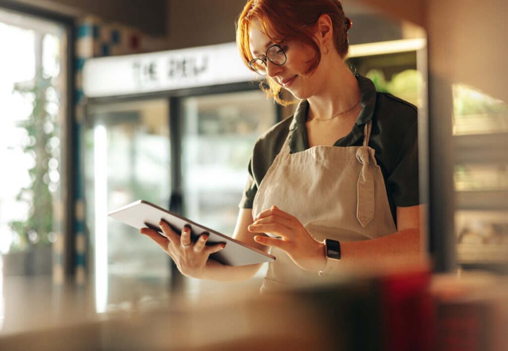 Grocery Store Owner Checking Accounting Books